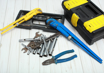 Old tools for repair of the house equipment and bathroom equipment.