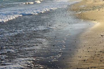 Ocean waves on sandy beach