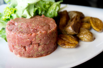 tasty Steak tartare (Raw beef) - classic steak tartare on white plate