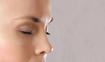 Face of a young caucasian lady. Closeup