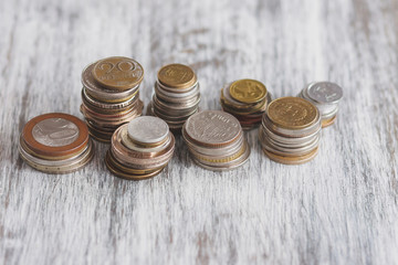 Different collector coins on the wooden background