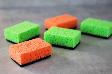 Household cleaning sponges for cleaning on gray  background.