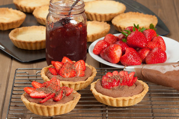 Homebaked Strawberry Tartlets With Ganache. Decorated.