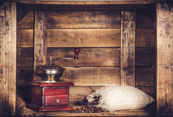 antique coffee grinder with coffee beans