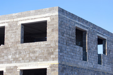 Windows in a brick house under construction