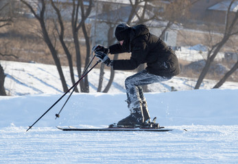 Fototapeta na wymiar A man skiing in a ski resort