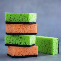Household cleaning sponges for cleaning on gray  background.