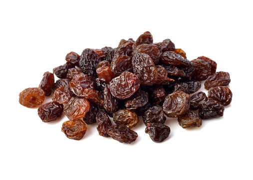 Dried raisins on white background.