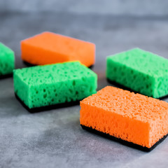 Household cleaning sponges for cleaning on gray  background.