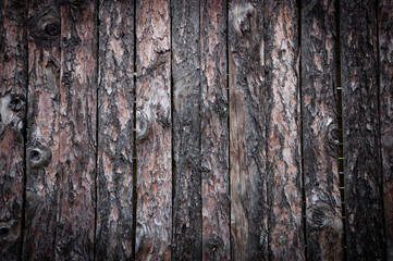 Natural pine lining boards with bark. Abstract rustic wooden background. 