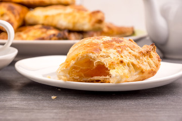 Delicious golden sweet triangles of puff pastry close-up