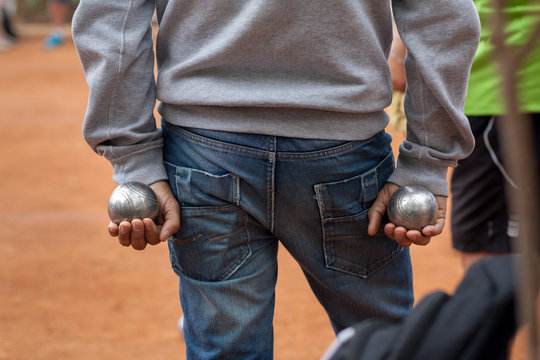 Petanque boules game. Man throwing boules