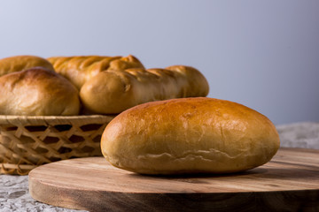 Fresh homemade burger bread buns on dark wood background