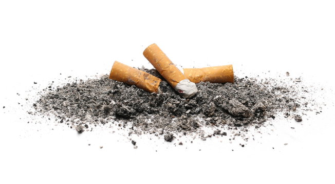 Cigarette butts, stubs and ash pile isolated on white background