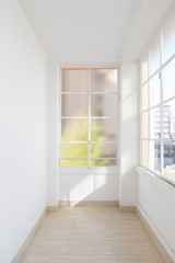 Fototapeta premium Bright empty corridor with large windows