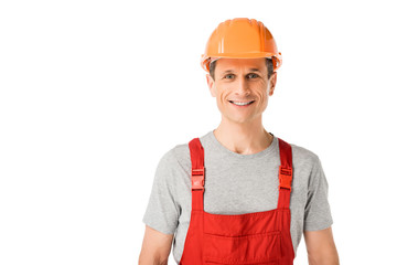 Professional builder in overalls and hardhat isolated on white