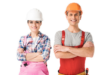 Smiling professional builders man and woman isolated on white