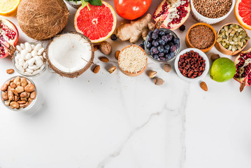 Set of organic healthy diet food, superfoods - beans, legumes, nuts, seeds, greens, fruit and vegetables.. white background copy space. top view