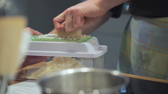 Slow Motion Cooking: Grating Parmesan Cheese Into a Container