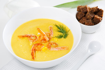 Corn Soup with shrimp and Croutons on a white background