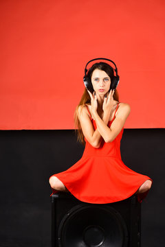 Singer with thoughtful face listens to music. Technologies and music