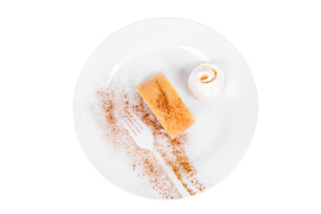 apple pie, charlotte with vanilla ice cream, served on a plate isolated white background, pattern, fork of cocoa. Dessert for a menu in a cafe, restaurant, coffee shop view from above