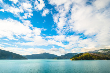 Landscape of the Mountain and sea with cloudy in the morning. View from the ferry to  South Island, New Zealand.