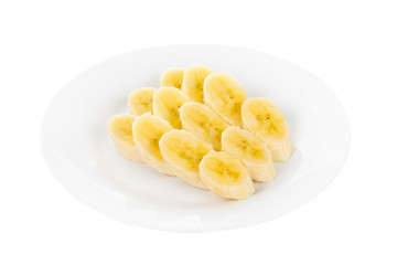 Peeled slices of banan on a plate isolated white background. Dessert for a menu in a cafe, restaurant, coffee shop side view