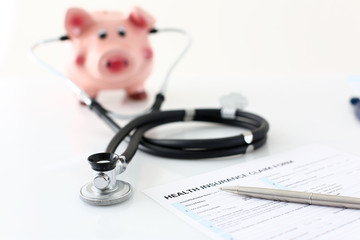 Silver pen lying on health application form