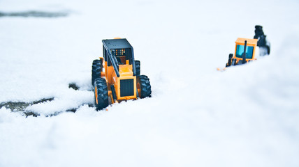 Two forklings standing side by side and a snowy winter.