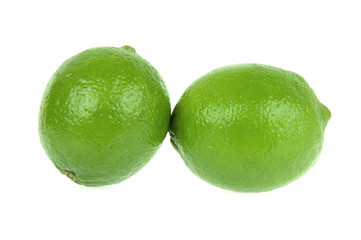 Lime. Two ripe fruits isolated on white background