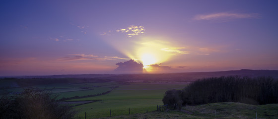 Spring sunset over South Downs from Old Winchester Hill - an Iron Age fort - on the South Downs, Hampshire, UK