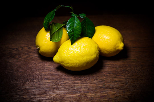 still life of fresh limines on dark wood