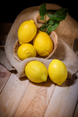 still life of fresh limines on dark wood