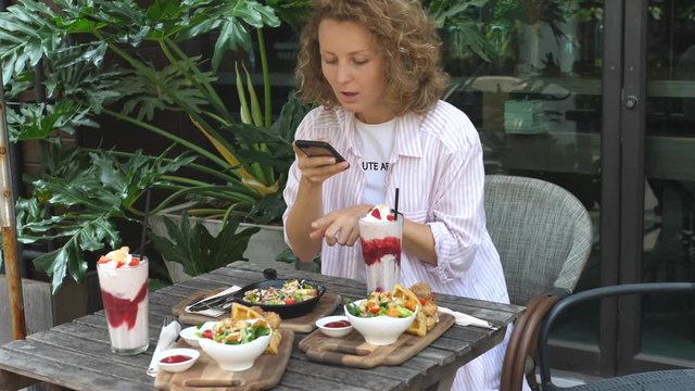 Female Blogger Shooting Stories Of Food In Cafe Sharing In Social Media