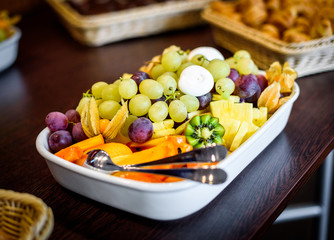 Fruit platter bowl buffet at business or wedding event venue.