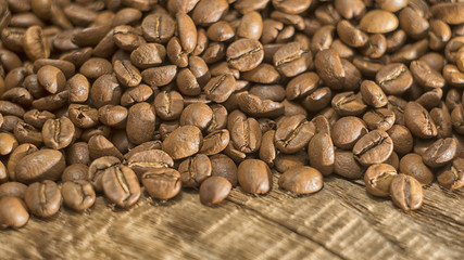 Coffee Beans over Wood Background