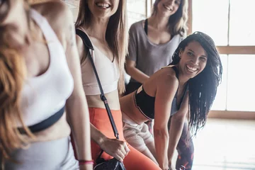 Poster Women laughing in fitness studio © LStockStudio
