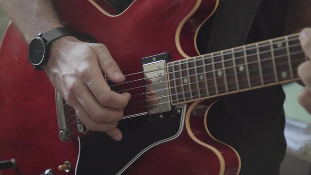 Close up shot of a guitar being played