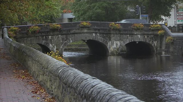 Still shot of an old Irish stone bridge over a canal.