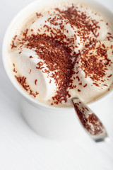 Hot chocolate and marshmallow sprinkled with chocolate chips.