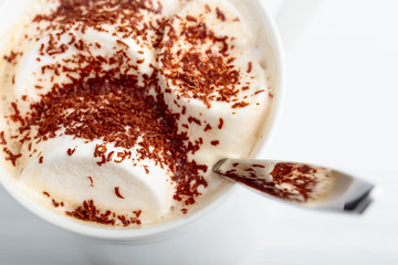 Hot chocolate and marshmallow sprinkled with chocolate chips.