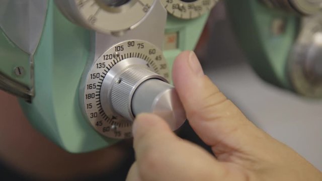 Closeup shot of a hand adjusting a dial