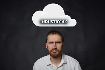 Above the businessman hangs a cloud with the inscription:INDUSTRY 4.0