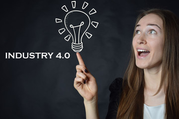 A businessman shows an inscription:INDUSTRY 4.0