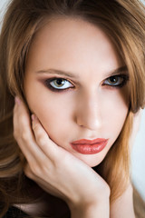 Beauty woman face. Close up of beautiful young female model with fresh natural makeup.
