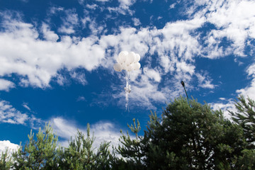 very beautiful white inflatable balls on a blue sky