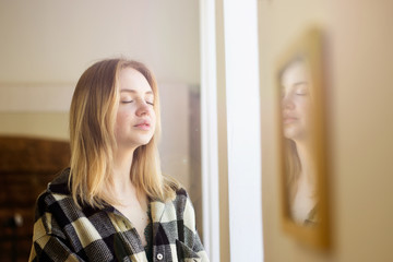 young girl near the window