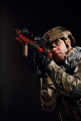 Fototapeta premium Image of sighted soldier with gun