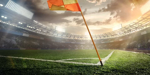 Tuinposter Sport. Empty football soccer field with white marks, green grass texture and orange corner flag. © vitaliy_melnik